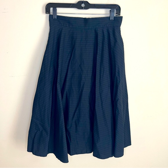 Uniqlo Dresses & Skirts - Uniqlo black striped a-line midi skirt women’s size medium pockets elastic waist